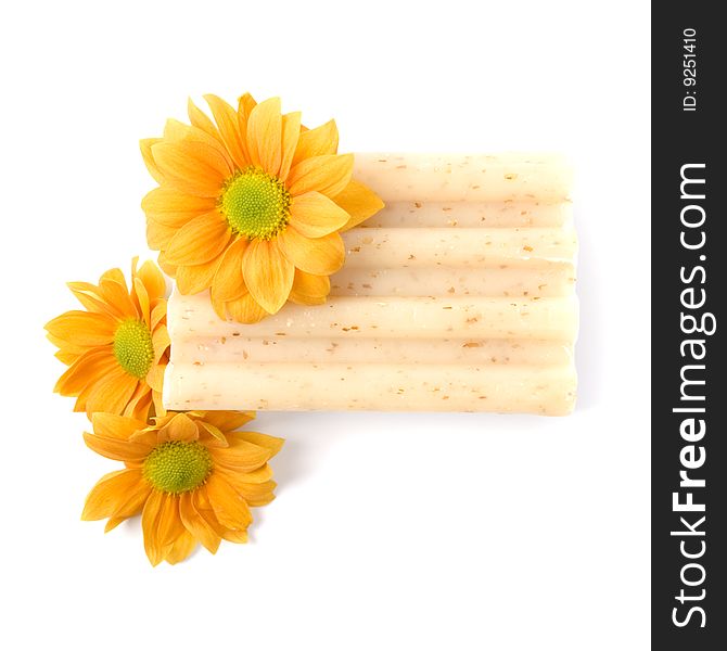 Natural soap and flowers isolated on white background