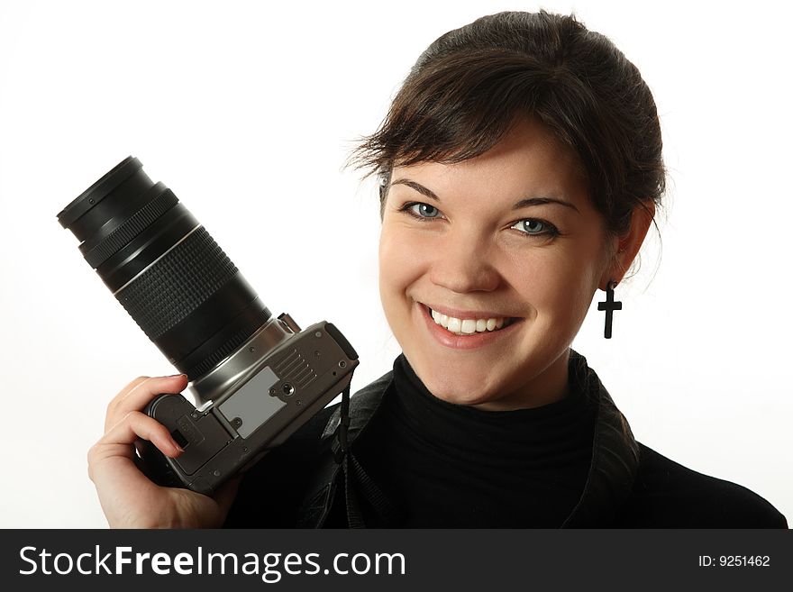 The beautiful girl with a camera on a white background