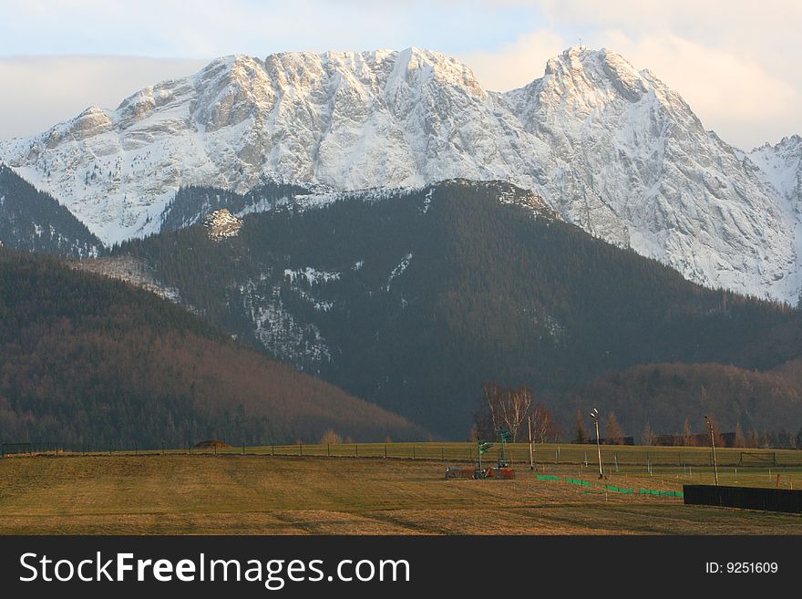 Slope in the spring with mountains in background, Tatras Mountains