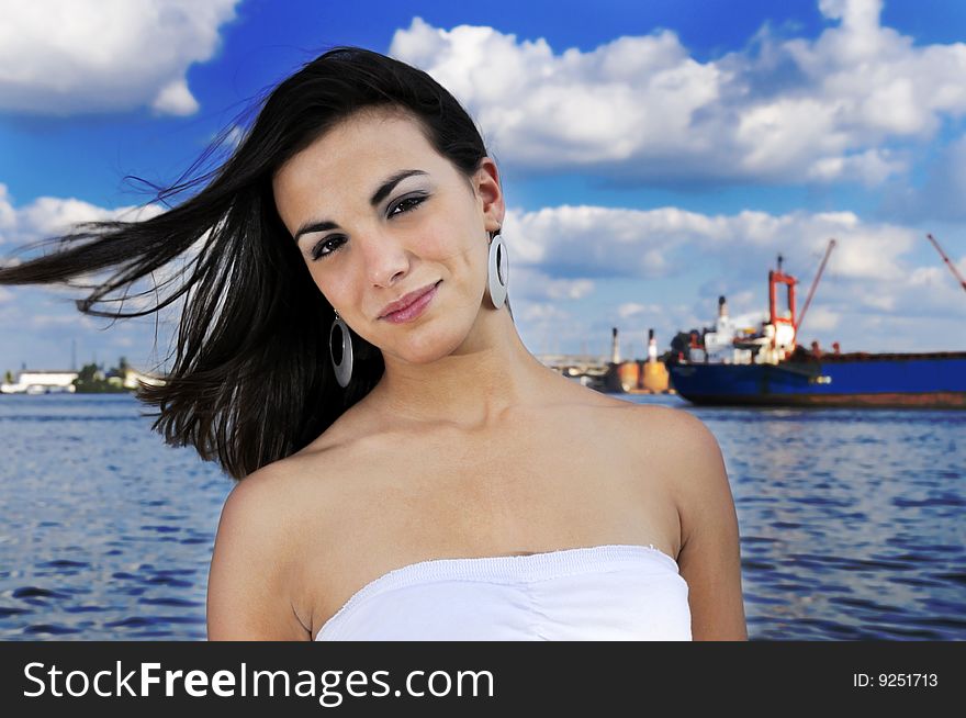 Portrait of natural teen girl posing on harbor background. Portrait of natural teen girl posing on harbor background