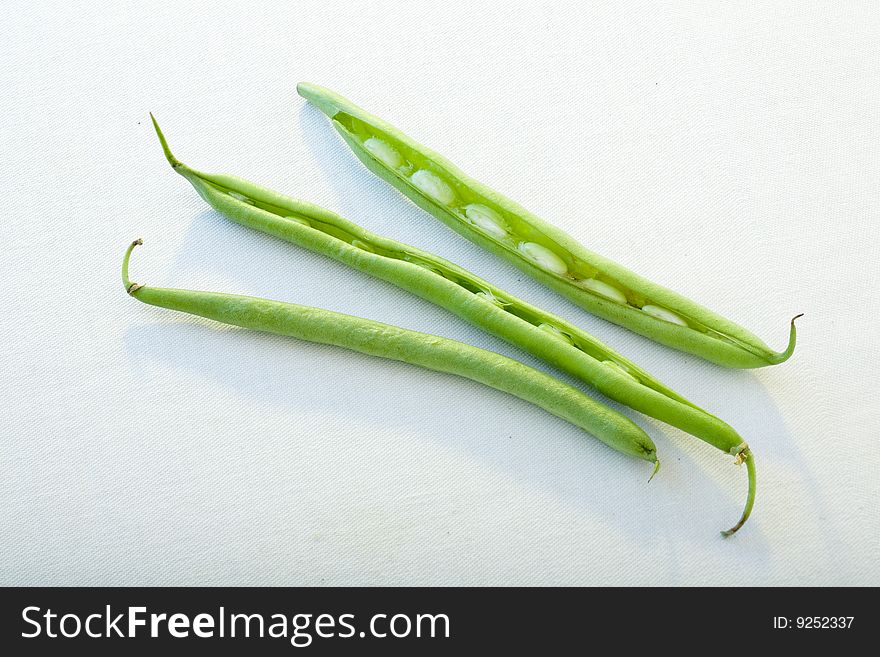 Green beans against white background