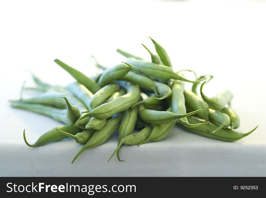 Green beans against white background