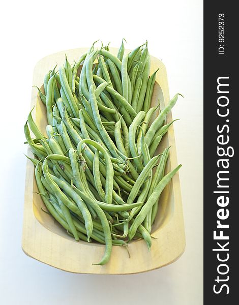 Green beans in a wooden bowl