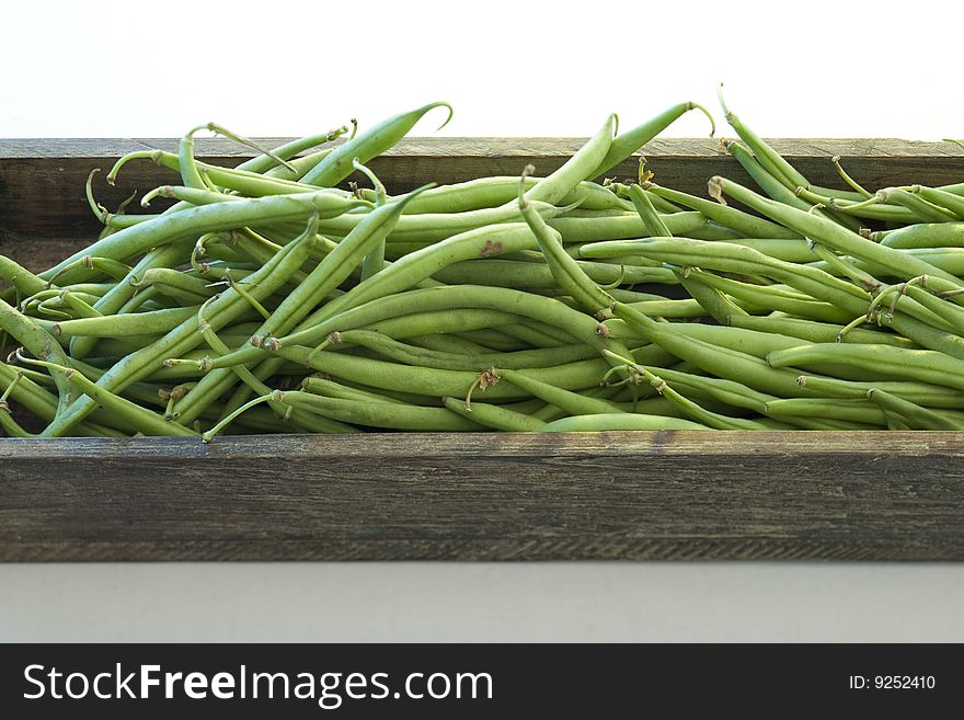 Green beans in a wooden bowl