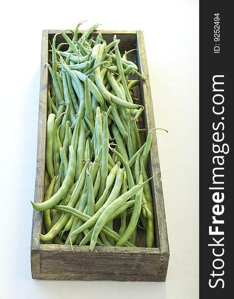Green beans in a wooden bowl