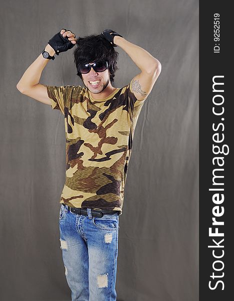 Portrait of young trendy male with attitude and sunglasses. Portrait of young trendy male with attitude and sunglasses