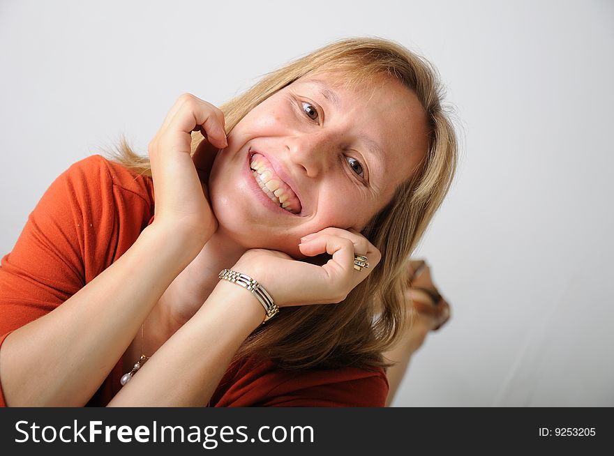 Colorful women laying down with hands under her chin. Colorful women laying down with hands under her chin