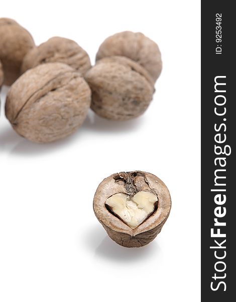 The isolated walnut on white in the form of heart