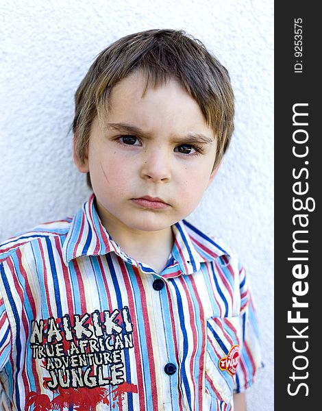 Serious looking portrait of a young boy. Intense, but very cute. Serious looking portrait of a young boy. Intense, but very cute.