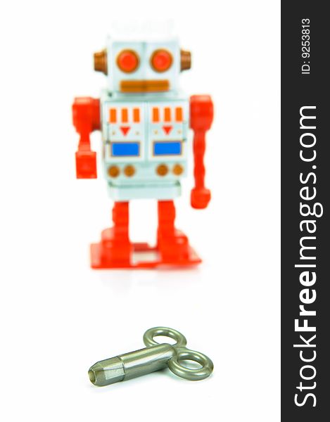 A toy robot isolated against a white background