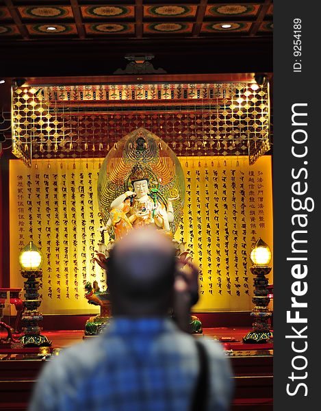 Bald Tourist filing in a chinese buddhist temple