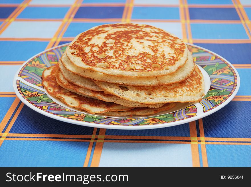 Stack of pancakes on checkered map