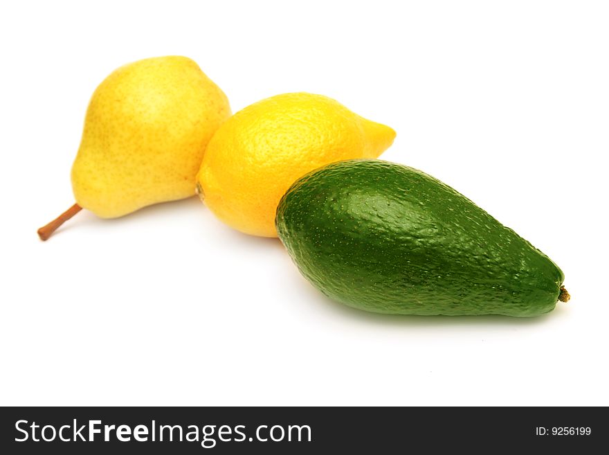 Pear,lemon and avocado isolated on white. Pear,lemon and avocado isolated on white.