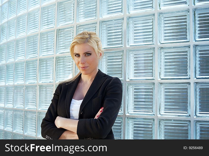 Business Woman Leaning On Glass Bricks