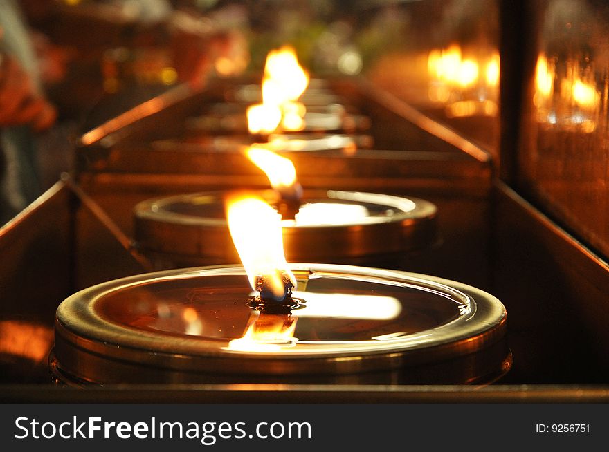 Oil lamp in a temple in Thailand. The lamp on the importance of religion One is faith. Oil lamp in a temple in Thailand. The lamp on the importance of religion One is faith.