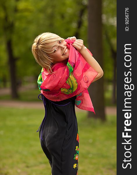 Young beautiful woman in the green park