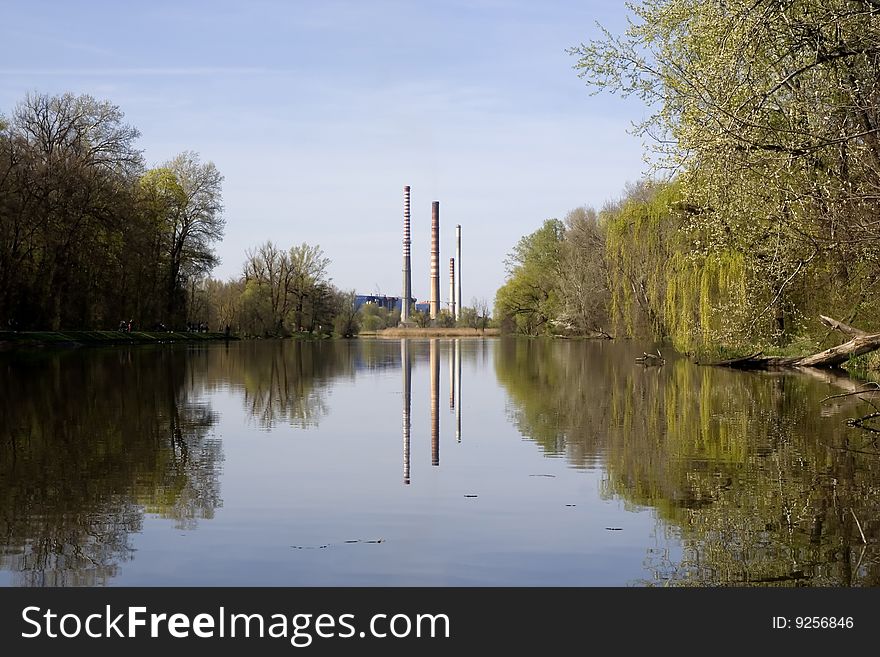 Mirror reflection of the factory chimneys