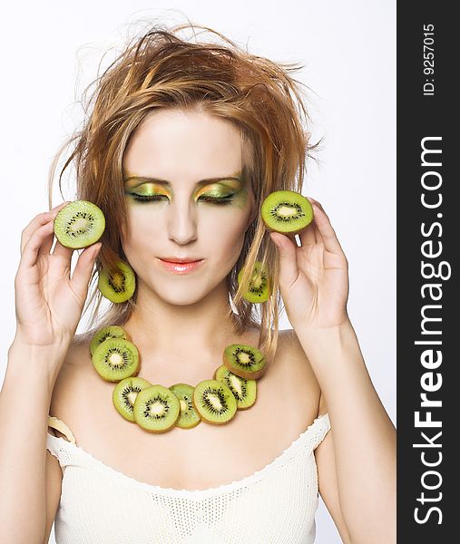 Portrait of young attractive woman with fruits