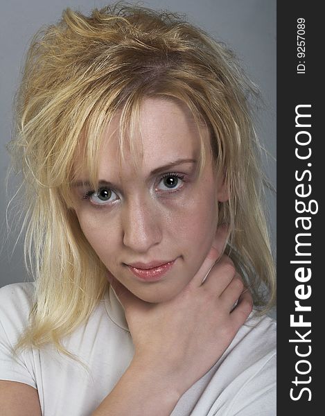 Portrait of young blond girl in white shirt. Portrait of young blond girl in white shirt