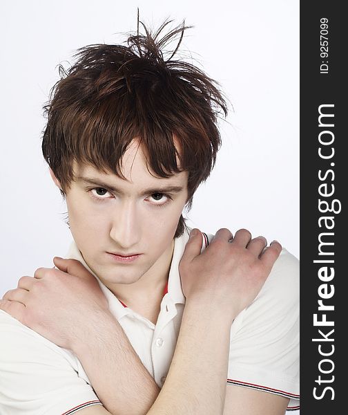 Portrait of young man in white shirt. Portrait of young man in white shirt