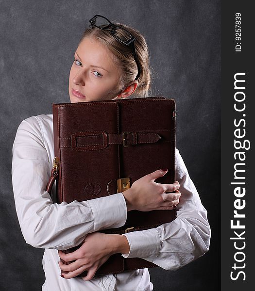 Woman Hugging A Briefcase