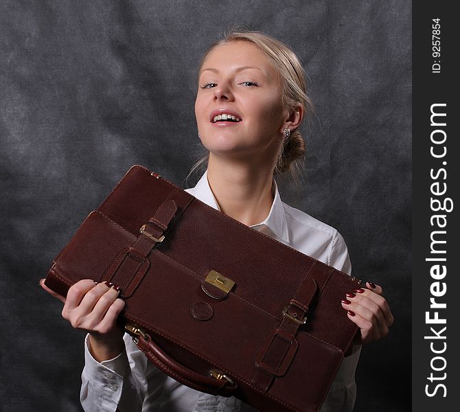 Woman holding brown leather briefcase. Woman holding brown leather briefcase