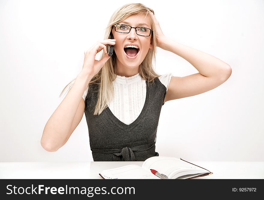 Young pretty joyful businesswoman at work. Young pretty joyful businesswoman at work