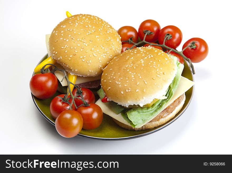 Delicious juicy hamburgerys goodness with lettuce, tomato, cheese and ketchup. Delicious juicy hamburgerys goodness with lettuce, tomato, cheese and ketchup