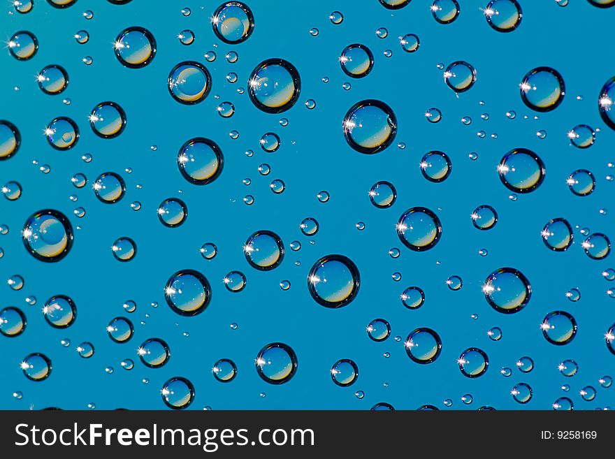 A lot of drops on blue background. A lot of drops on blue background