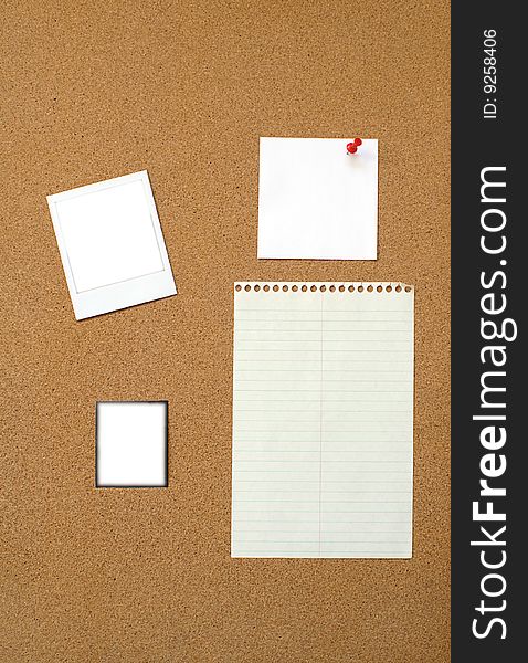 Lined paper, square note paper, polaroid  and transparency pinned on bulletin board. Lined paper, square note paper, polaroid  and transparency pinned on bulletin board