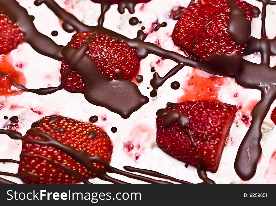 Close up of strawberry cake with chocolate and strawberries