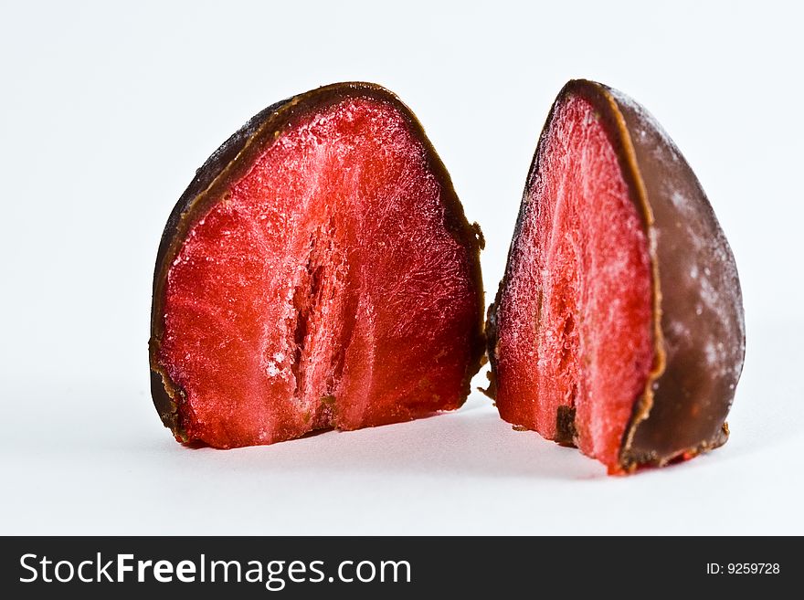 Two chocolate strawberries isolated on plain white background