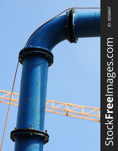 Industrial pipeline against clear blue sky