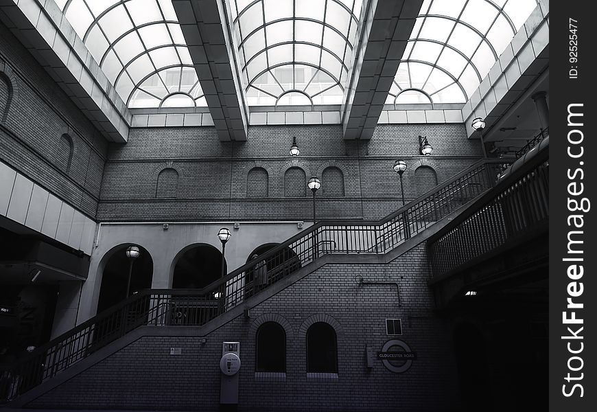 A modern building with stairs and skylights in the ceiling. A modern building with stairs and skylights in the ceiling.