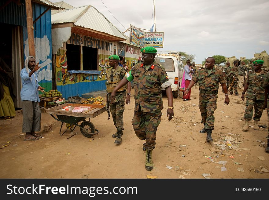 African Union Mission in Somalia &#x28;AMISOM&#x29; Force Commander Lt. Gen. Andrew Gutti &#x28;centre&#x29; gestures towards a Somali man during a visit to Afgoye Town located 30km to the west of the Somali capital Mogadishu. AMISOM supporting Somali National Army &#x28;SNA&#x29; forces recently liberated the Afgoye Corridor from the Al Qaeda-affiliated extremist group Al Shabaab, pushing them further away from Mogadishu and opening up the free flow of goods and produce between the fertile agricultural area surrounding Afgoye and the Somali capital. AU-UN IST PHOTO / STUART PRICE. African Union Mission in Somalia &#x28;AMISOM&#x29; Force Commander Lt. Gen. Andrew Gutti &#x28;centre&#x29; gestures towards a Somali man during a visit to Afgoye Town located 30km to the west of the Somali capital Mogadishu. AMISOM supporting Somali National Army &#x28;SNA&#x29; forces recently liberated the Afgoye Corridor from the Al Qaeda-affiliated extremist group Al Shabaab, pushing them further away from Mogadishu and opening up the free flow of goods and produce between the fertile agricultural area surrounding Afgoye and the Somali capital. AU-UN IST PHOTO / STUART PRICE.