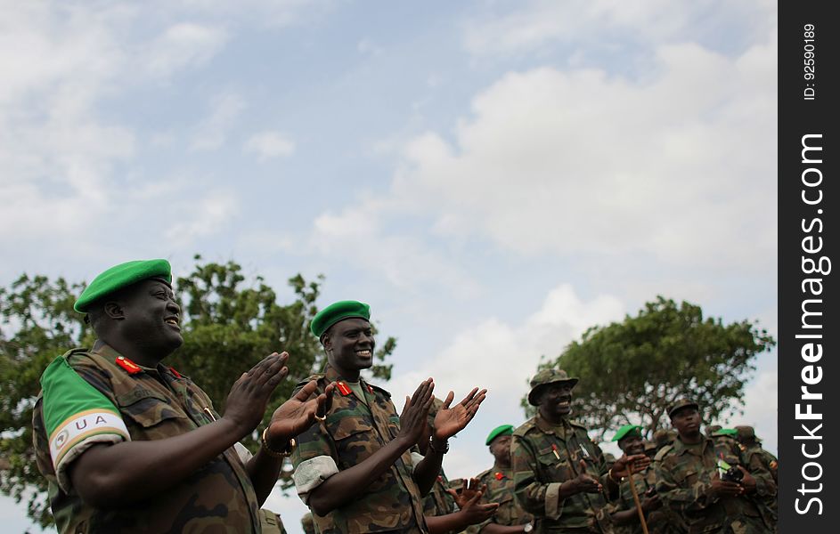 African Union Mission in Somalia &#x28;AMISOM&#x29; Force Commander Lt. Gen. Andrew Gutti &#x28;left&#x29; gestures with Brigadier Paul Lokech, Commander for the Ugandan Contigent serving with the AU operation during the recital of a patriotic song sung by Ugandan soldiers 5 June in Afgoye located 30km to the west of the Somali capital Mogadishu. AMISOM supporting Somali National Army &#x28;SNA&#x29; forces recently liberated the Afgoye Corridor from the Al Qaeda-affiliated extremist group Al Shabaab, pushing them further away from Mogadishu and opening up the free flow of goods and produce between the fertile agricultural area surrounding Afgoye and the Somali capital. AU-UN IST PHOTO / STUART PRICE. African Union Mission in Somalia &#x28;AMISOM&#x29; Force Commander Lt. Gen. Andrew Gutti &#x28;left&#x29; gestures with Brigadier Paul Lokech, Commander for the Ugandan Contigent serving with the AU operation during the recital of a patriotic song sung by Ugandan soldiers 5 June in Afgoye located 30km to the west of the Somali capital Mogadishu. AMISOM supporting Somali National Army &#x28;SNA&#x29; forces recently liberated the Afgoye Corridor from the Al Qaeda-affiliated extremist group Al Shabaab, pushing them further away from Mogadishu and opening up the free flow of goods and produce between the fertile agricultural area surrounding Afgoye and the Somali capital. AU-UN IST PHOTO / STUART PRICE.