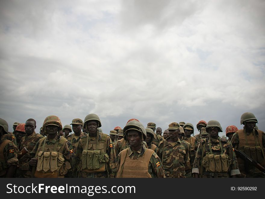 Ugandan soldiers serving with the African Union Mission in Somalia &#x28;AMISOM&#x29; stand 5 June during an address by AMISOM Force Commander Lt. Gen. Andrew Gutti &#x28;not seen&#x29; 5 June in Afgoye located 30km to the west of the Somali capital Mogadishu. AMISOM supporting Somali National Army &#x28;SNA&#x29; forces recently liberated the Afgoye Corridor from the Al Qaeda-affiliated extremist group Al Shabaab, pushing them further away from Mogadishu and opening up the free flow of goods and produce between the fertile agricultural area surrounding Afgoye and the Somali capital. AU-UN IST PHOTO / STUART PRICE. Ugandan soldiers serving with the African Union Mission in Somalia &#x28;AMISOM&#x29; stand 5 June during an address by AMISOM Force Commander Lt. Gen. Andrew Gutti &#x28;not seen&#x29; 5 June in Afgoye located 30km to the west of the Somali capital Mogadishu. AMISOM supporting Somali National Army &#x28;SNA&#x29; forces recently liberated the Afgoye Corridor from the Al Qaeda-affiliated extremist group Al Shabaab, pushing them further away from Mogadishu and opening up the free flow of goods and produce between the fertile agricultural area surrounding Afgoye and the Somali capital. AU-UN IST PHOTO / STUART PRICE.