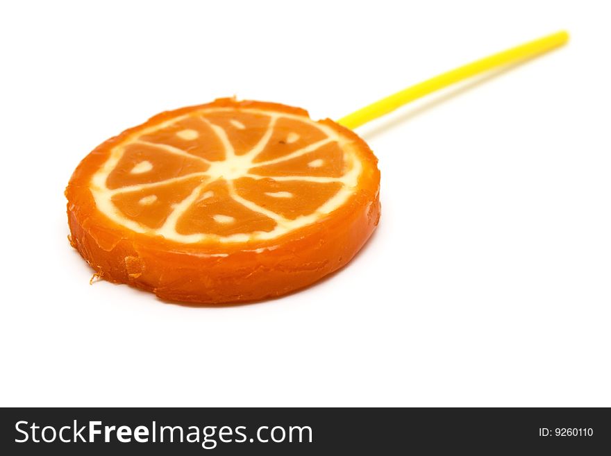 Sugar candies on  stick in the form of fruit on  white background. Sugar candies on  stick in the form of fruit on  white background