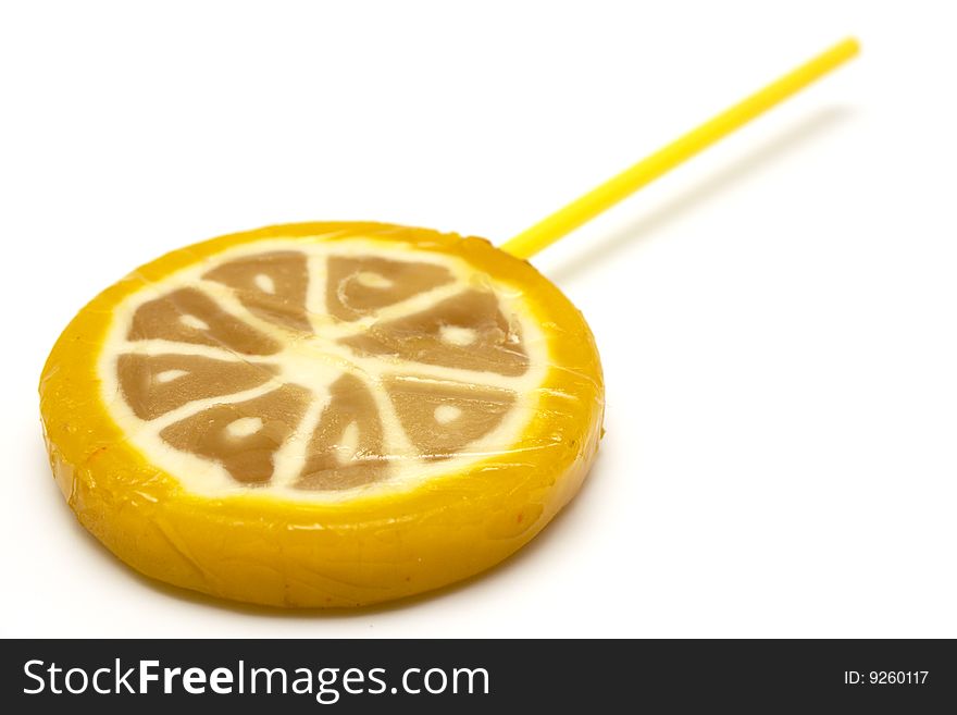 Sugar candies on  stick in the form of fruit on  white background. Sugar candies on  stick in the form of fruit on  white background