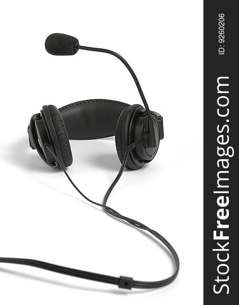 Black headphone with microphone on white background