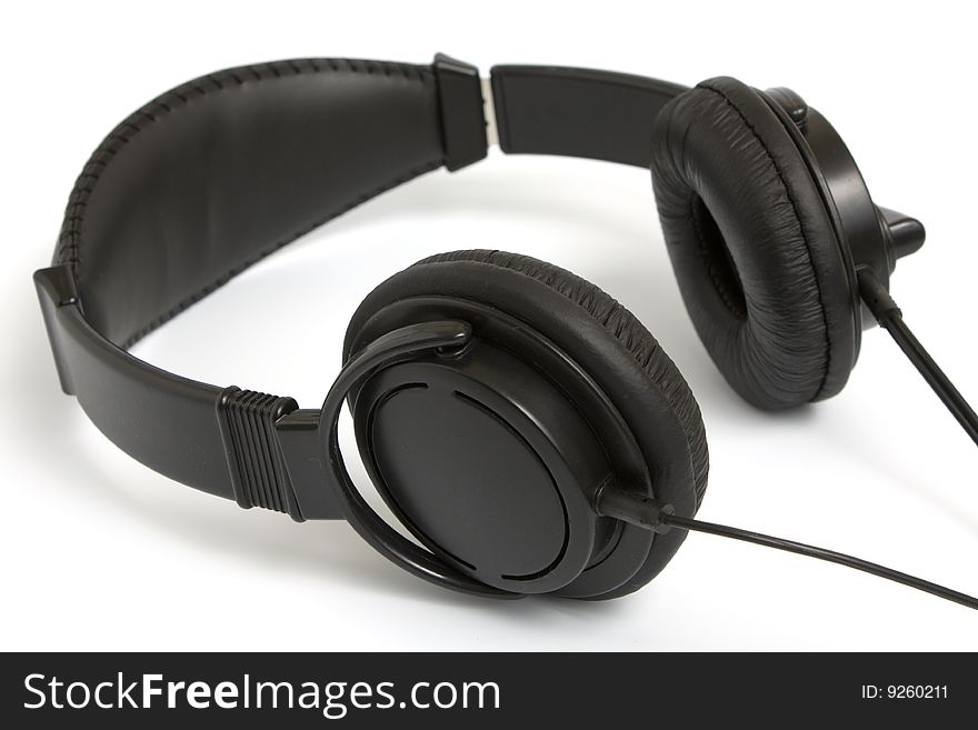Black headphone for listening music on white background