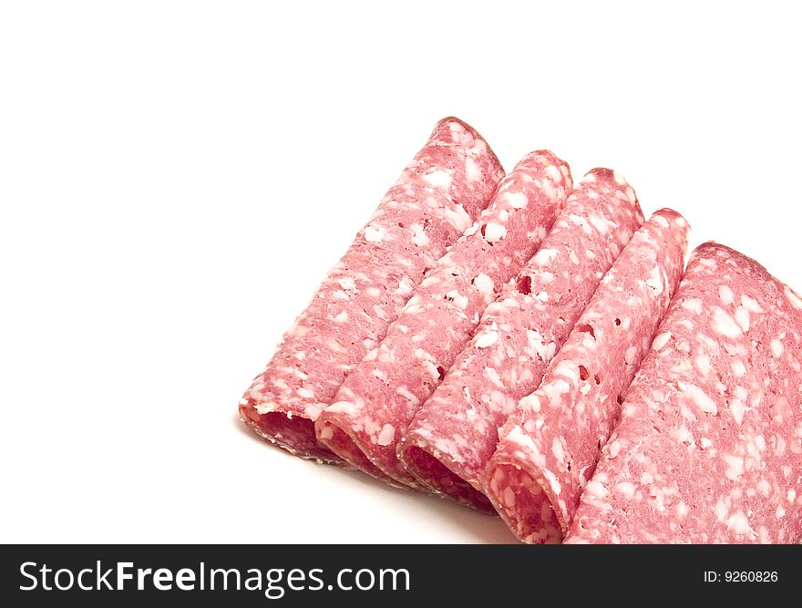 Slices of salami photography studio with white background