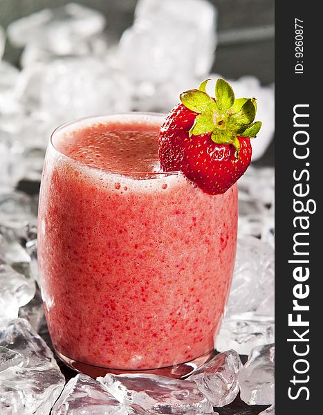 Glass of freshly made strawberry smoothie. Glass of freshly made strawberry smoothie