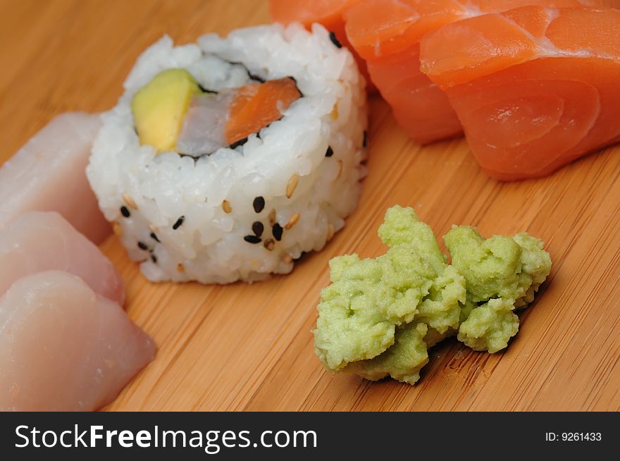 Mixed japanese food on a wooden background - shallow dof. Mixed japanese food on a wooden background - shallow dof