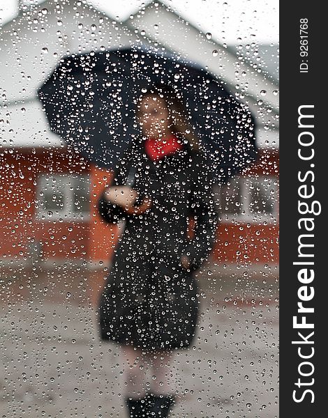 Beautiful girl with red scarf and umbrella