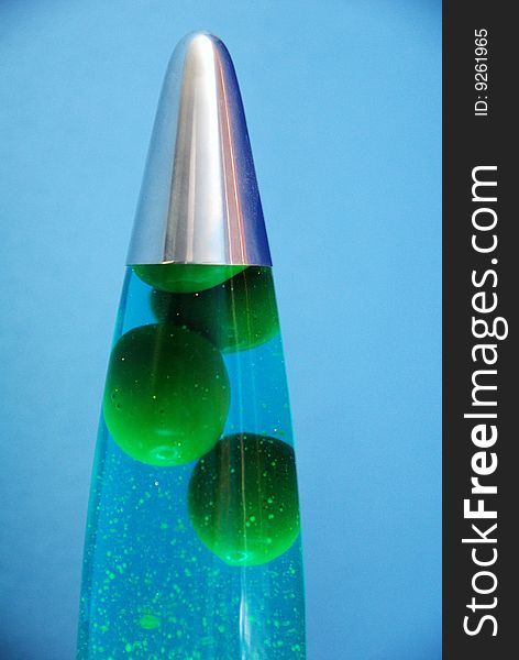 Blue lava lamp with green bubbles