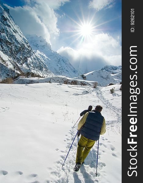 Hikers go up in mountains