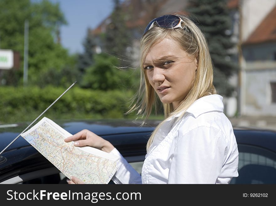 Girl with the road map in the hand