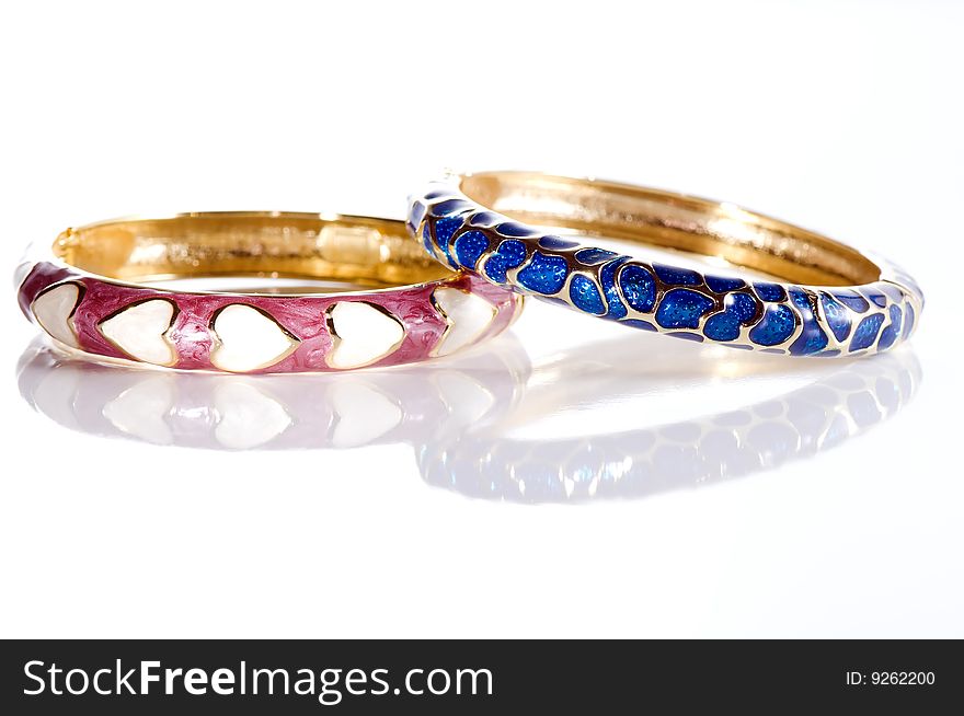 Pair of colorful bracelets on white background