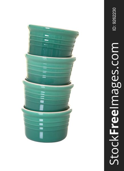 Stack of four green ramekins isolated. Stack of four green ramekins isolated